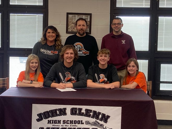 John Glenn senior Ethan Haney, center, signs his Letter of Intent to attend Indiana Tech to continue his academic and lacrosse career next fall. Pictured are Front Row: sister Eva Haney, Ethan Haney, brother Evan Haney, sister Ella Haney Back Row: Mother Marcie Haney, Father Todd Haney, John Glenn Lacrosse Coach Bob Williams