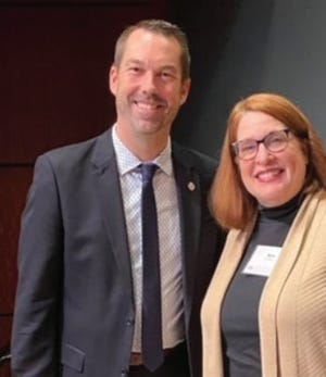Ann Felder is shown with Michigan School Band and Orchestra Association President Matthew Shephard when she was presented with the Orchestra Teacher of the Year Award at the Michigan Music Conference in Grand Rapids.