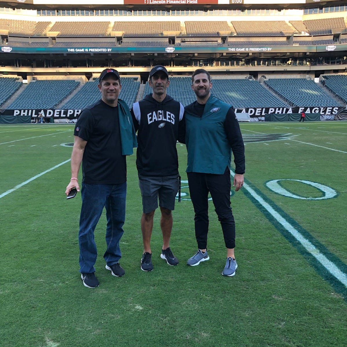 Brothers Mike Sirianni (left), Jay Sirianni (middle) and Nick Sirianni (right) pose for an undated photo at Lincoln Financial Field in Philadelphia.