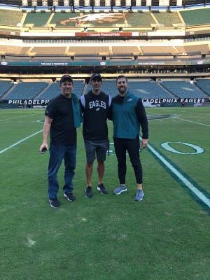 Brothers Mike Sirianni (left), Jay Sirianni (middle) and Nick Sirianni (right) at Lincoln Financial Field in Philadelphia.