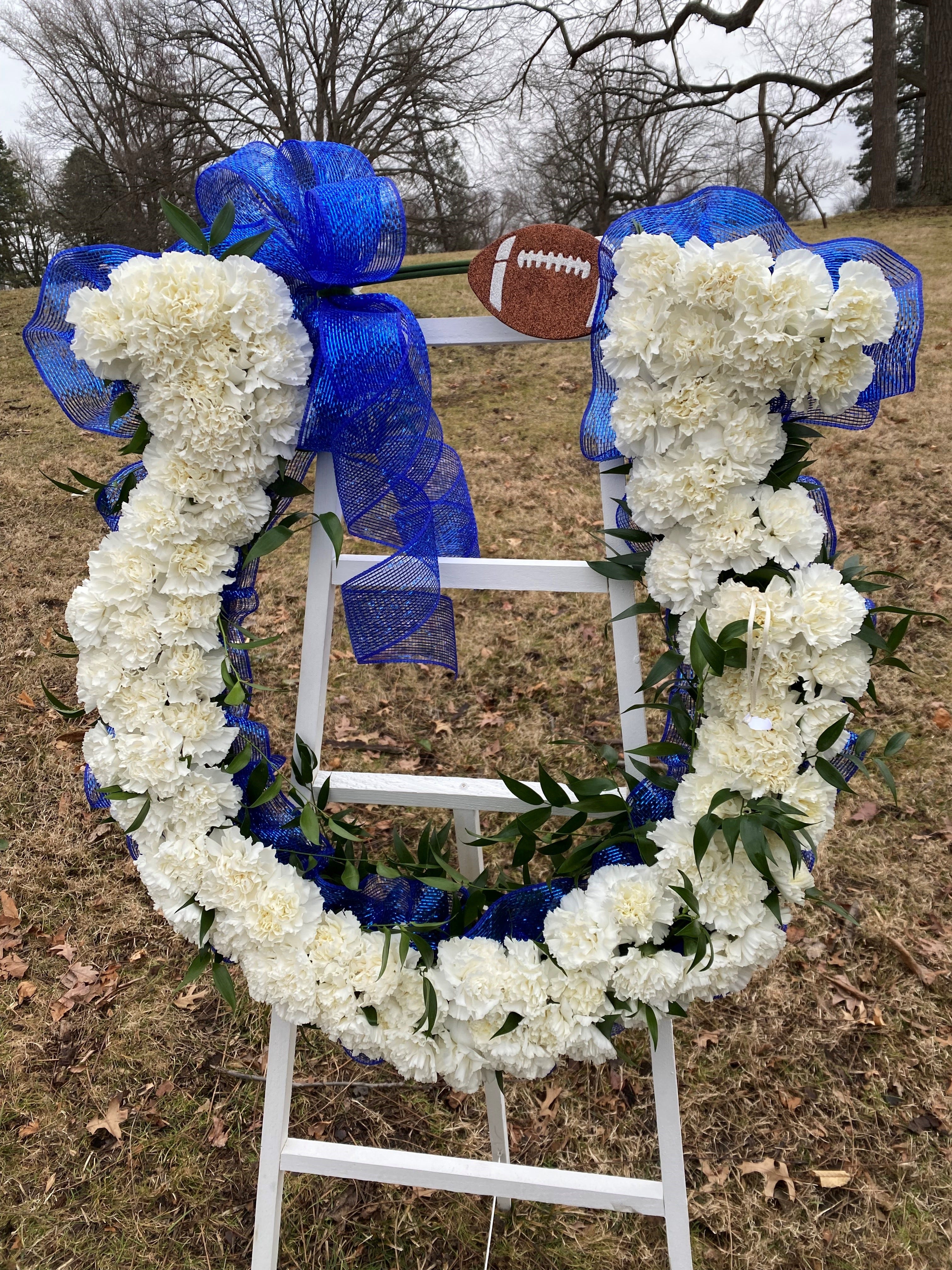 The Indianapolis Colts paid for the funeral, burial and repass for Indy Steelers coach Richard Donnell Hamilton. Flowers shaped as the Colts' horseshow are displayed at Crown Hill Cemetery gravesite.