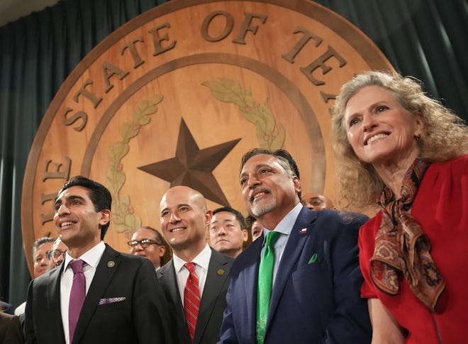 From left, state Reps. Salman Bhojani, D-Euless, Jacey Jetton, R-Richmond, Suleman Lalani, D-Sugar Land, and Donna Howard, D-Austin, pose for a group photo at a news conference Tuesday about three religious freedom bills.