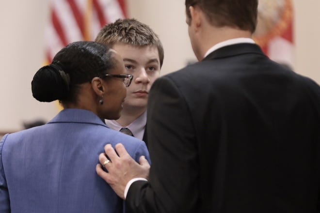 Aiden Fucci talks with his attorneys Rosemarie Peoples and Craig Atack after the 16-year-old pleaded guilty on Feb. 6 to the first-degree murder of 13-year-old Tristyn Bailey in St. Johns County.