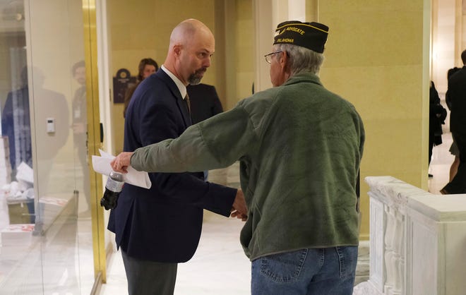 Retired Army veteran Gary Decor, right, thanks state Rep. Jay Steagall for authoring House Bill 1080. The bill would strip much of the governor's authority to appoint the Oklahoma Veterans Commission.
