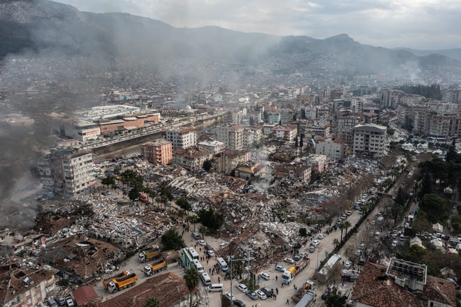 HATAY, TURKEY - FEBRUARY 07: Smoke billows from the scene of a collapsed buildings on February 07, 2023 in Hatay, Turkey. A 7.8-magnitude earthquake hit near Gaziantep, Turkey, in the early hours of Monday, followed by another 7.5-magnitude tremor just after midday. The quakes caused widespread destruction in southern Turkey and northern Syria and were felt in nearby countries.  (Photo by Burak Kara/Getty Images) ORG XMIT: 775936971 ORIG FILE ID: 1463832206