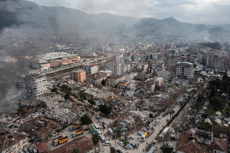 HATAY, TURKEY - FEBRUARY 07: Smoke billows from the scene of a collapsed buildings on February 07, 2023 in Hatay, Turkey. A 7.8-magnitude earthquake hit near Gaziantep, Turkey, in the early hours of Monday, followed by another 7.5-magnitude tremor just after midday. The quakes caused widespread destruction in southern Turkey and northern Syria and were felt in nearby countries.  (Photo by Burak Kara/Getty Images) ORG XMIT: 775936971 ORIG FILE ID: 1463832206