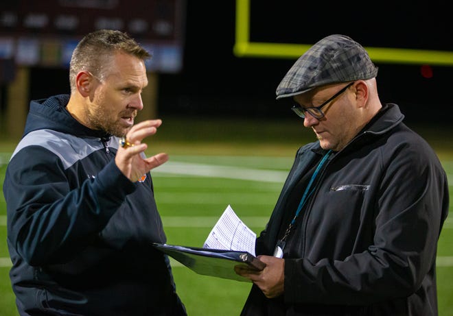Hutto Hippos head coach Brad LaPlante (left) is interviewed by Statesman reporter Thomas Jones at the end of the game against the Shadow Creek Sharks at the Class 5A-1 area football playoff on Friday, Nov 22, 2019, at Waller Stadium.