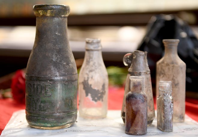 Eslich Wrecking Co. workers found a half dozen old bottles during the demolition of two buildings in downtown Massillon