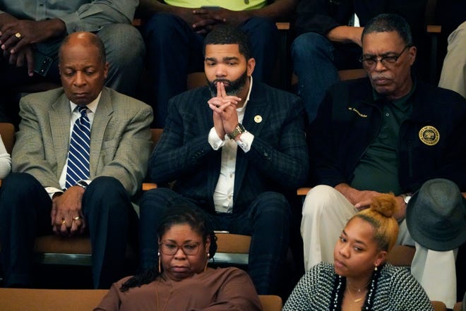Jackson Mayor Chokwe Antar Lumumba, center, sits with staff as he watches lawmakers debate House Bill 1020, which would create a separate court system in the Capitol Complex Improvement District on Tuesday at the Mississippi Capitol in Jackson.