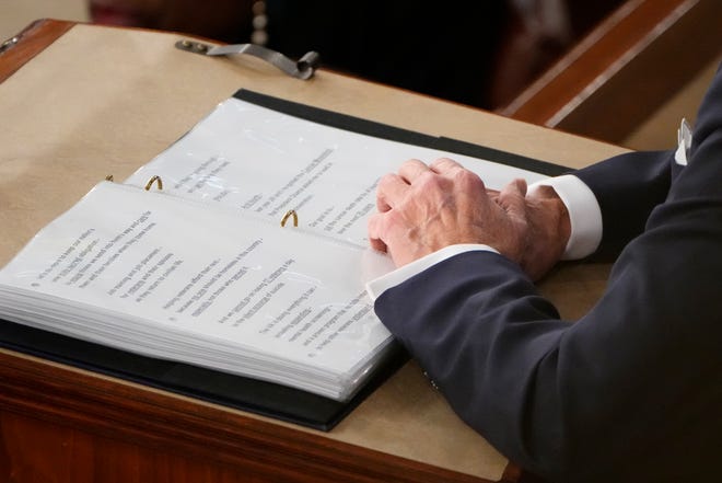 Detail of President Joe Biden’s hands and notes during the State of the Union address from the House chamber of the United States Capitol in Washington.