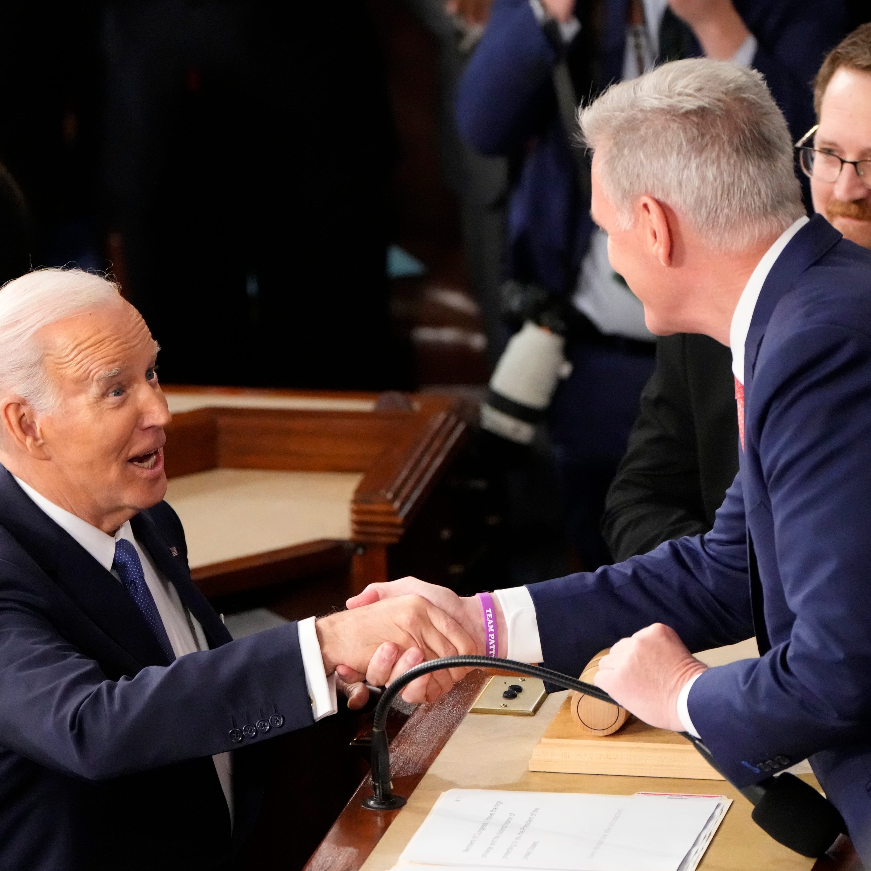 President Joe Biden greets House Leader Kevin McCarthy of Calif. during the State of the Union address from the House chamber of the United States Capitol in Washington.
