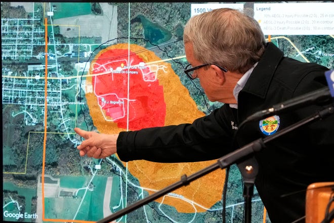 Ohio Gov. Mike DeWine points to a map of East Palestine, Ohio that indicates the area that has been evacuated as a result of Norfolk Southern train derailment, after touring the site, Feb. 6, 2023.
