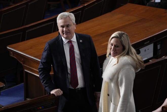Rep. James Comer, R-KY, and Rep. Marjorie Taylor Greene, R-GA, arrive ahead of the State of the Union address from the House chamber of the United States Capitol in Washington. 