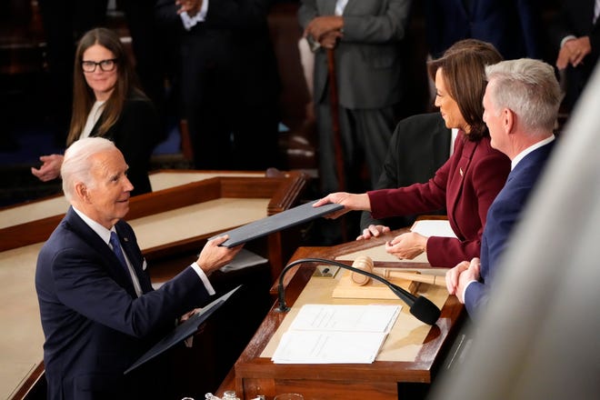 President Joe Biden greets Vice President Kamala Harris and House Leader Kevin McCarthy of Calif. during the State of the Union address from the House chamber of the United States Capitol in Washington.