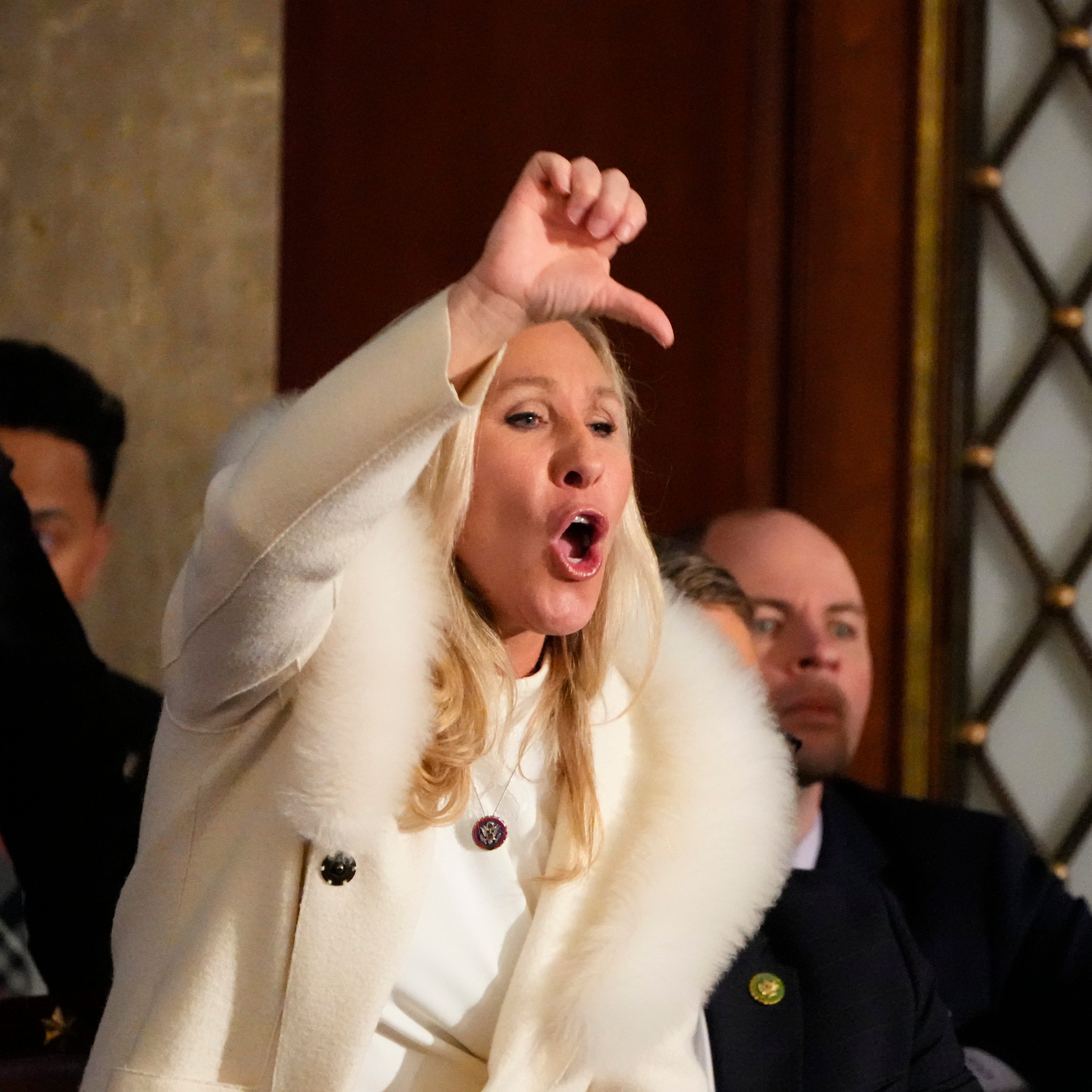 Rep. Marjorie Taylor Greene, R-GA, yells in the chambers as President Joe Biden speaks during the State of the Union address from the House chamber of the United States Capitol in Washington. 
