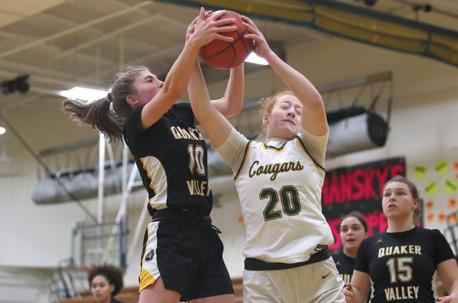 Blackhawk's Aubree Hupp (20) and Quaker Valley's Nora Johns (10) fight for control of a rebound during the first half Wednesday night at Blackhawk High School.