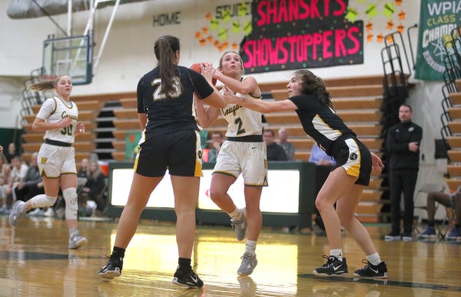 Blackhawk's Cassie Potts (2) goes for a layup while being guarded by Quaker Valley's Nora Johns (10) and Maria Helkowski (23) during the first half Wednesday night at Blackhawk High School.
