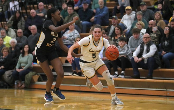 Blackhawk's Quinn Borroni (5) drives to the basket while being guarded by Quaker Valley's Oumou Thiero (2) during the second half Wednesday night at Blackhawk High School.