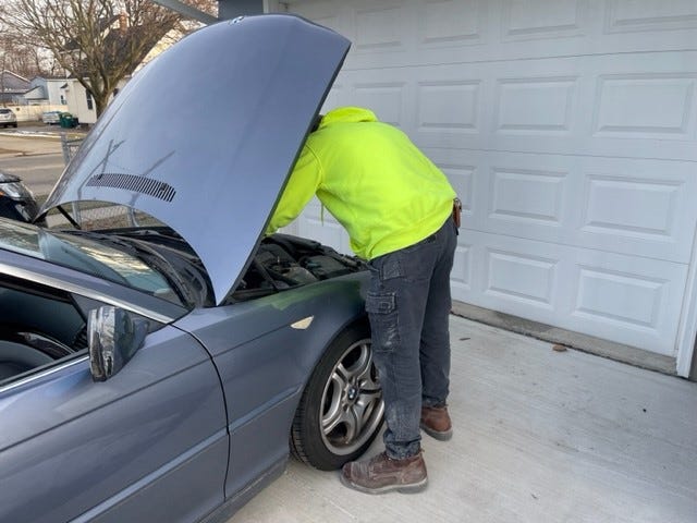 The husband of Phoebe Wall Howard, a master electrician who belongs to the International Brotherhood of Electrical Workers (IBEW), asked that he not be identified on Wednesday, January 8, 2023 while working on a vehicle not made by the Detroit Three.