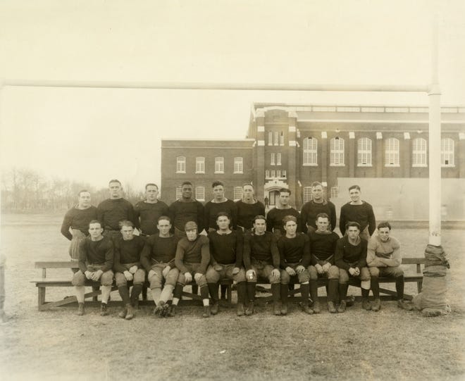 Jack Trice (fourth from left top row) is shown with his Iowa State University football team in the early 1920s.