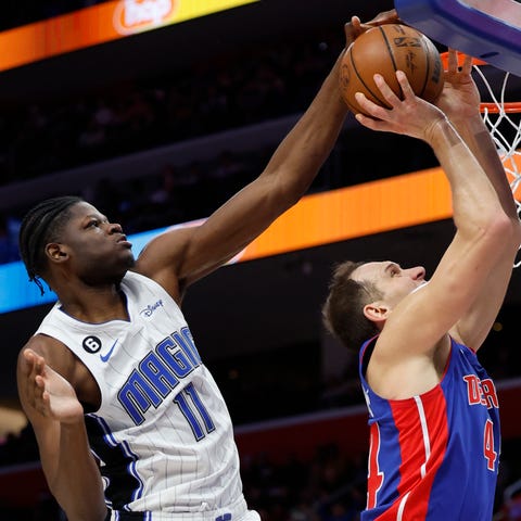 Mo Bamba blocks a shot by Pistons forward Bojan Bo