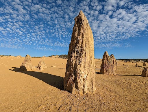 A pinnacle rock formation rises from the sand in Nambung National Park, Western Australia.