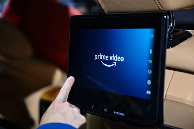 Netflix password sharing gets the ax. Will Disney+, Hulu follow suit? The Amazon Prime Video logo is displayed in a Jeep Grand Wagoneer SUV, with Amazon Alexa and Fire TV technology built-in, during the Consumer Electronics Show (CES) in Las Vegas, Nevada in January.
