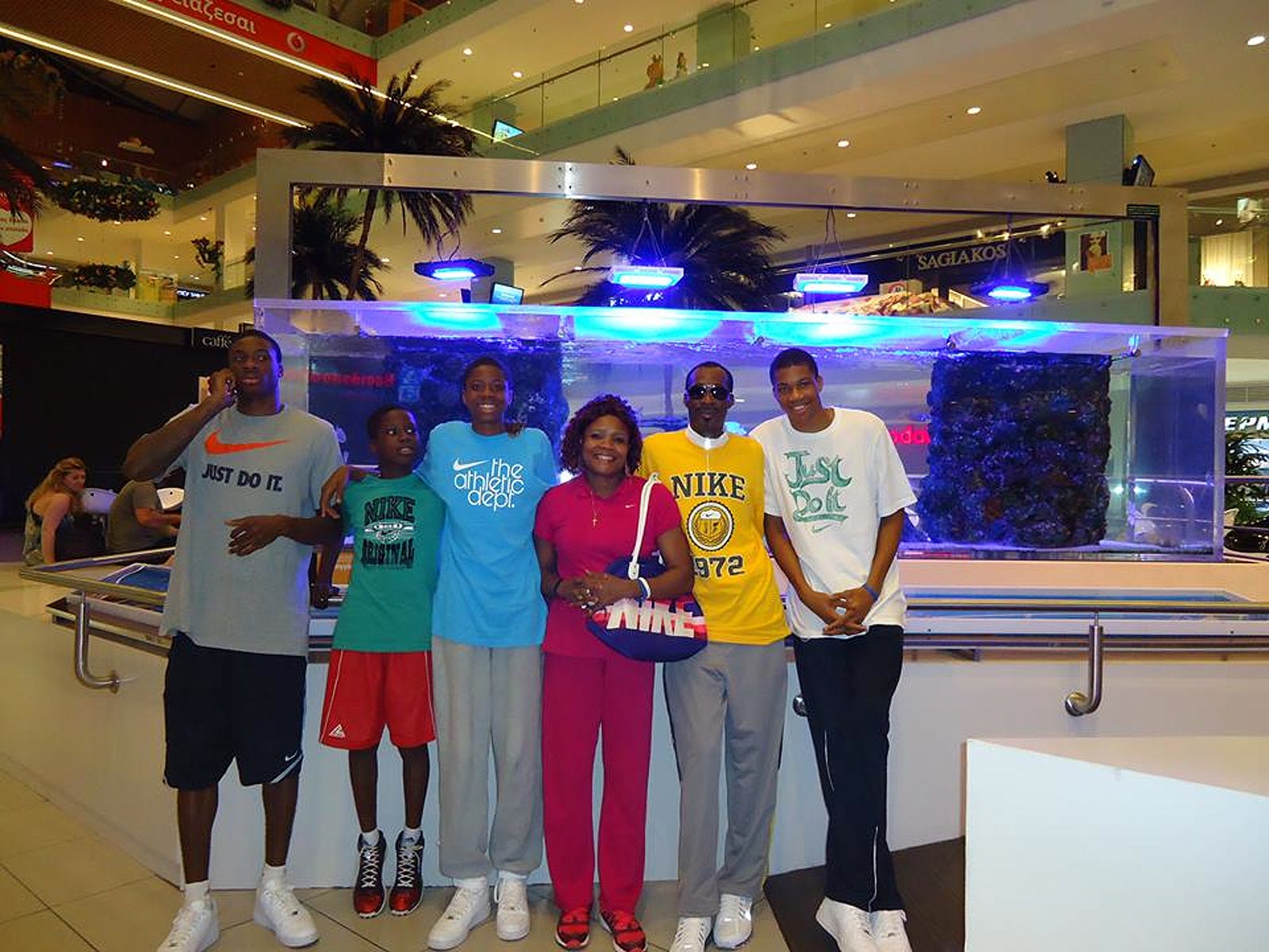 Giannis Antetokounmpo, right, poses with family members, from left, brothers Thanasis, Alex and Kostas, mother Vero and father Charles.