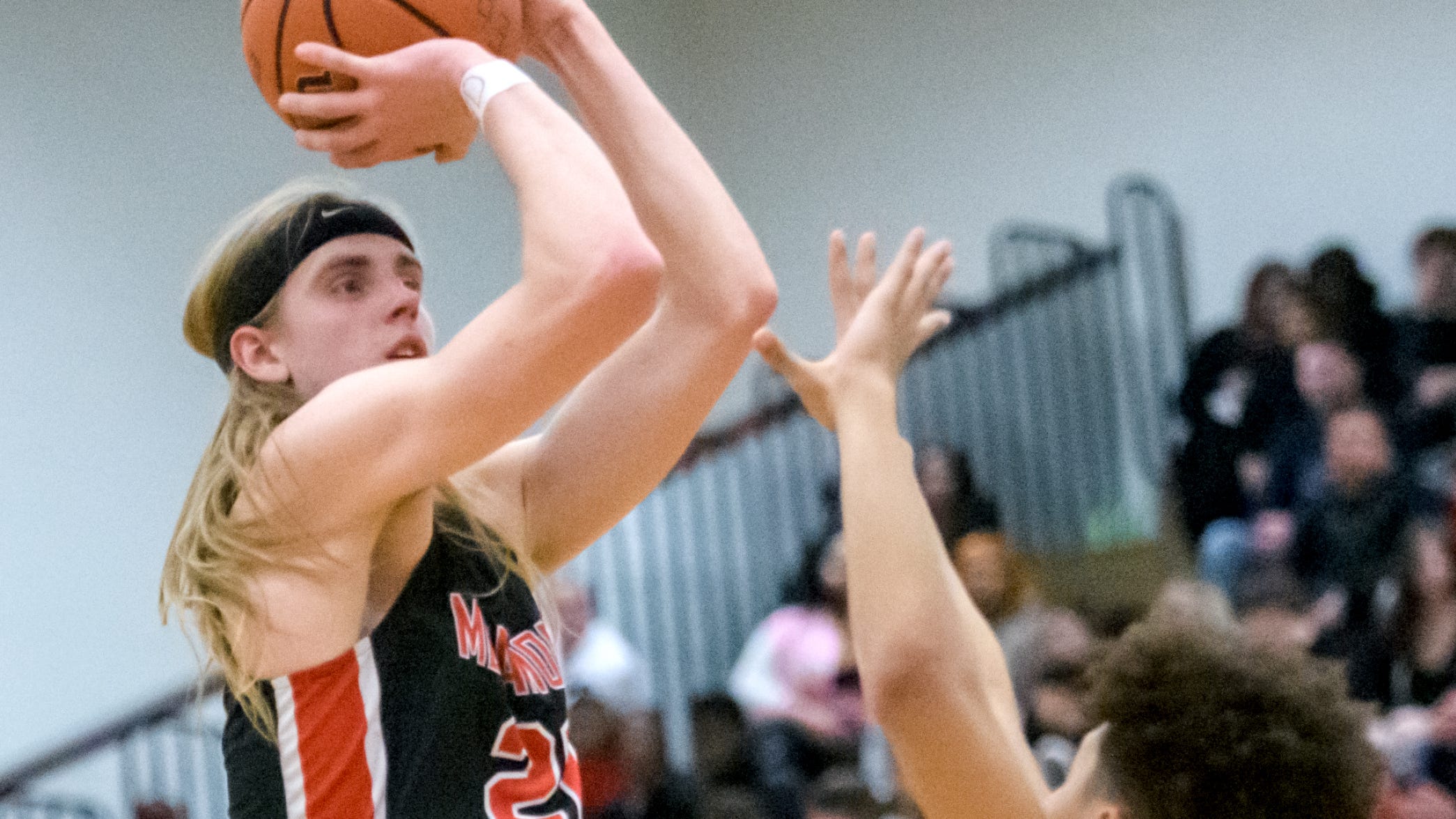 Metamora's Ethan Kizer shoots over East Peoria's Cam Mables in the second half Friday, Feb. 10, 2023 at East Peoria High School. The Redbirds defeated the Raiders 60-50.