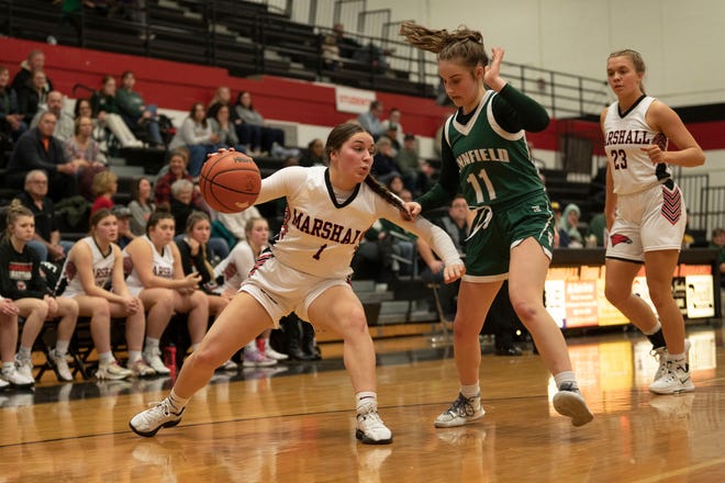 Marshall junior Addison Waito dribbles during a game against Pennfield at Marshall High School on Friday, Feb. 10, 2023.