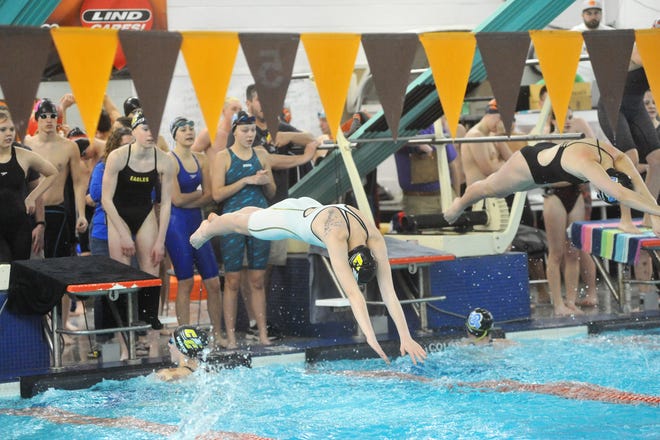 Colonel Crawford's Ava Finnan dives in to anchor the 200 free relay at sectionals.