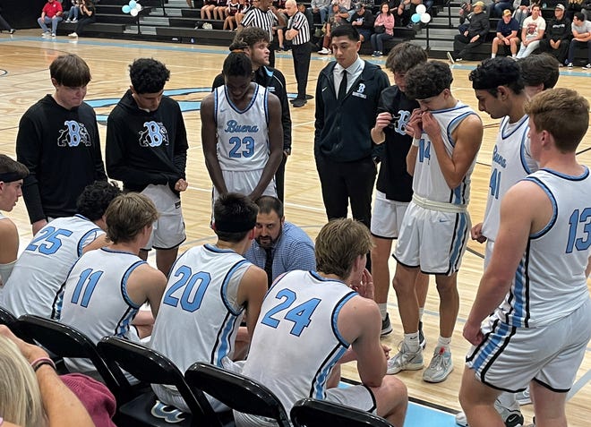 Buena head coach Matt Colton goes over strategy during the Bulldogs' 66-56 win over Artesia in a CIF-SS Division 3AA second-round game Friday night at Buena High.