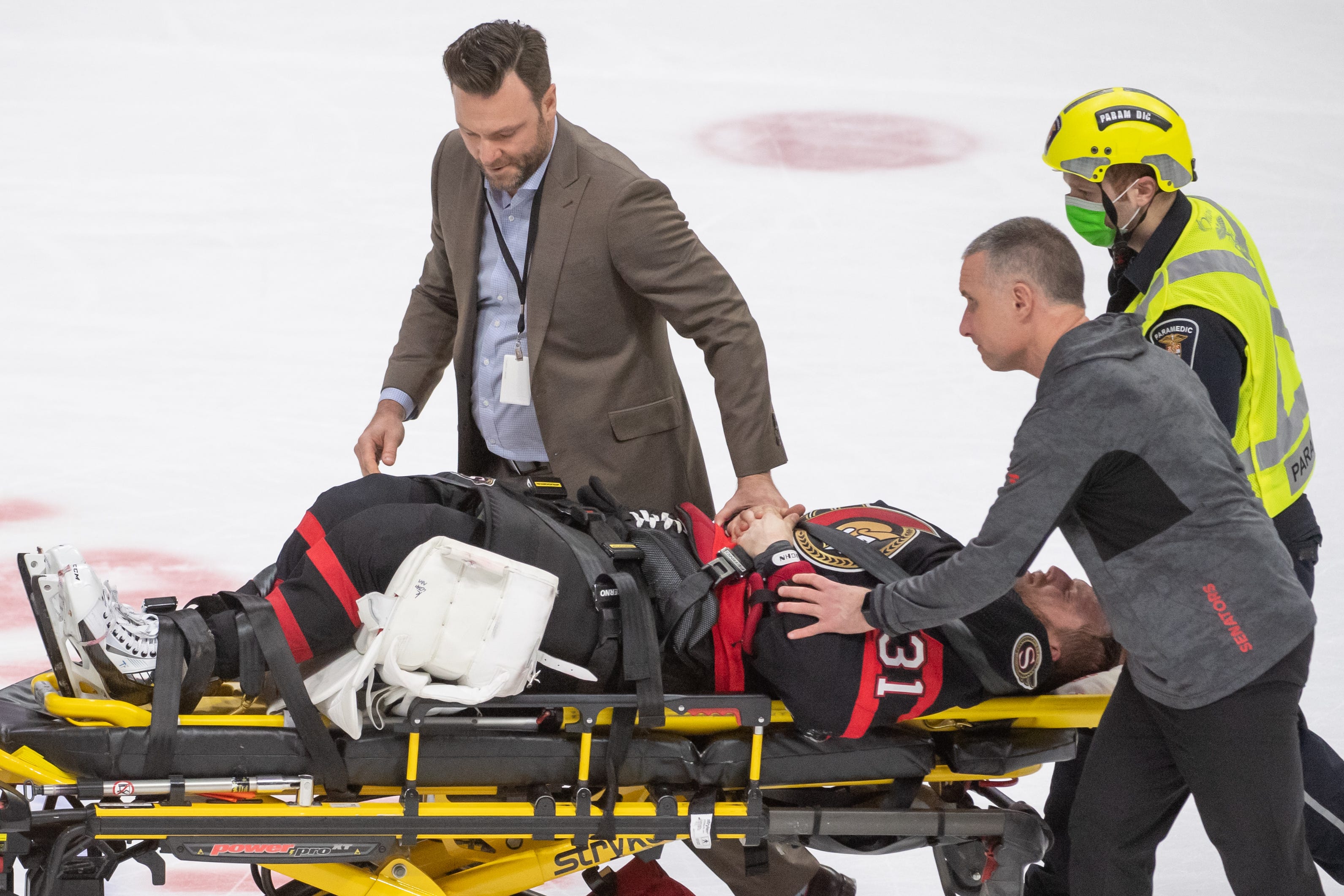 Senators' Anton Forsberg stretchered off ice with injury after Oilers' Zach Hyman lands on him