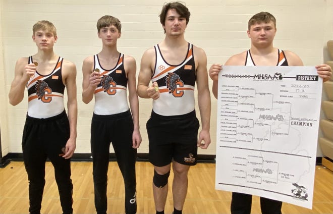 From left, Cheboygan wrestlers Chase Swanson, Jeremiah Huntley, Robert LaPointe and Devihn Wichlacz each qualified for next weekend's regional round during a MHSAA Division 3 individual district meet in Grayling on Saturday, Feb. 11. Holding his bracket, Wichlacz took home first place in the 285-pound weight class.