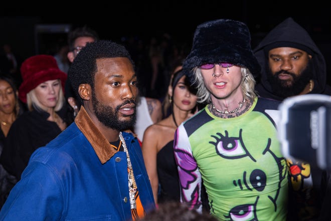 Meek Mill (left) and Machine Gun Kelly attend the Cash App & Visa Present h.wood Homecoming party in Scottsdale ahead of Super Bowl 57 on Feb. 10, 2023.