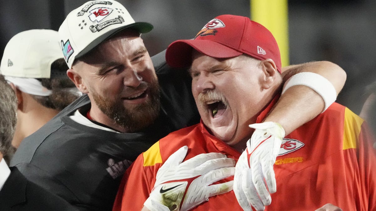 Chiefs head coach Andy Reid celebrates with tight end Travis Kelce on Sunday night.