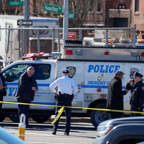 New York Police gather at the scene where a rental