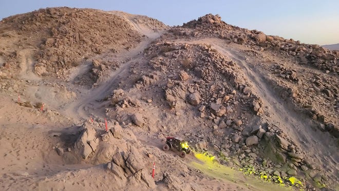 A Can-Am competitor descends the Chocolate Thunder rock ravine after nine hours out on course at the Progressive King of the Hammers Powered by OPTIMA Batteries. Many competitors don't complete the desert course.