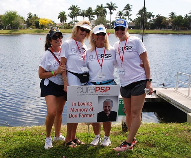 Posters of people who are fighting degenerative brain diseases or who have lost the battle are scattered around the lake got the CurePSP Awareness & Memorial Walk at Mackle Park on Marco Island.