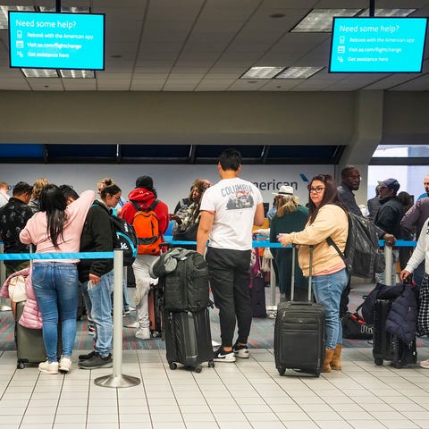 Passengers line up at an American Airlines custome