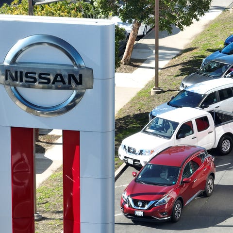 In an aerial view, a sign is posted in front of a 