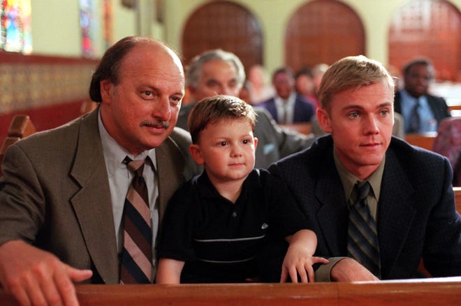 Sipowicz (Dennis Franz, left) and Sorenson (Rick Schroder, right) take pity on a recent parolee who has a fatalistic attitude when one of his friends turns up murdered in the "A Hole in Juan" episode of "NYPD Blue." Austin Majors (center) played Sipowicz's son, Theo.