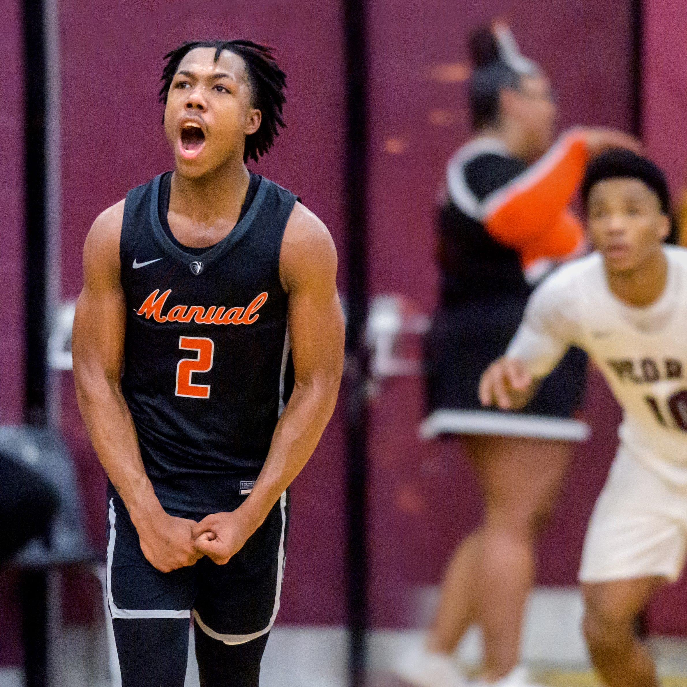 Manual's Gerron Trapps reacts to a fourth-quarter three-pointer late in the second half Saturday, Feb. 14, 2023 at Peoria High School. The Rams rallied to defeat the Lions 66-61.