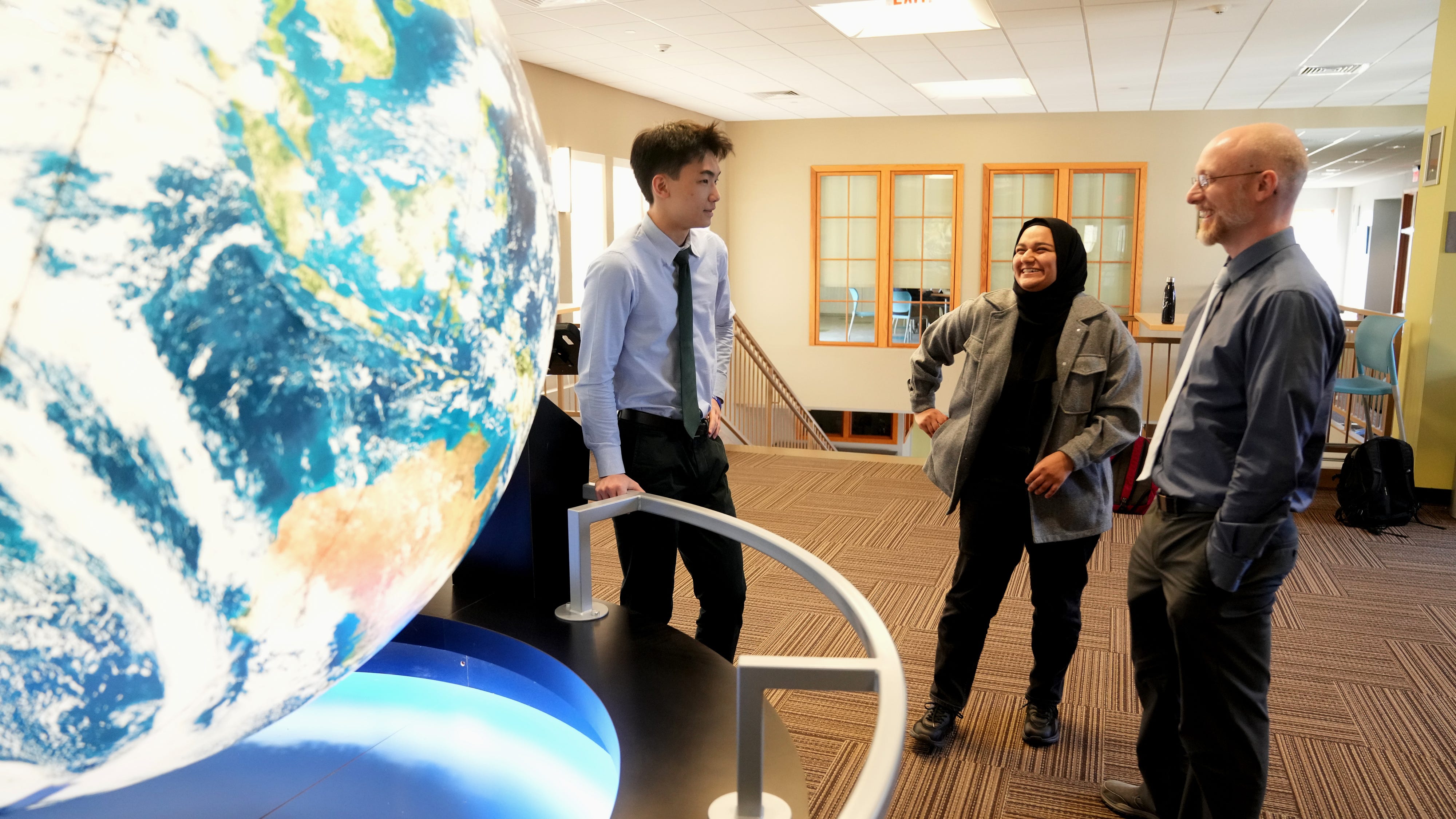 Dr. Seth Holm, chair of modern classics at the The Hun School in Princeton, New Jersey, leads a class of volunteer students in the Afghan Girl Education Project. Here he speaks on Feb. 14, 2023, with student volunteers who talk with Afghan girls by phone to try and teach them English.