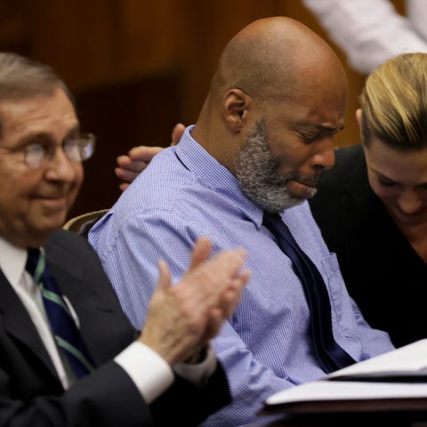 Lamar Johnson, center and his attorneys react on T