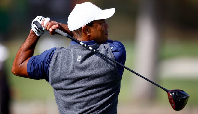 Tiger Woods hits balls on the practice range of the Riviera Country Club on Feb. 14 in preparation for this week's Genesis Invitational on the PGA Tour.