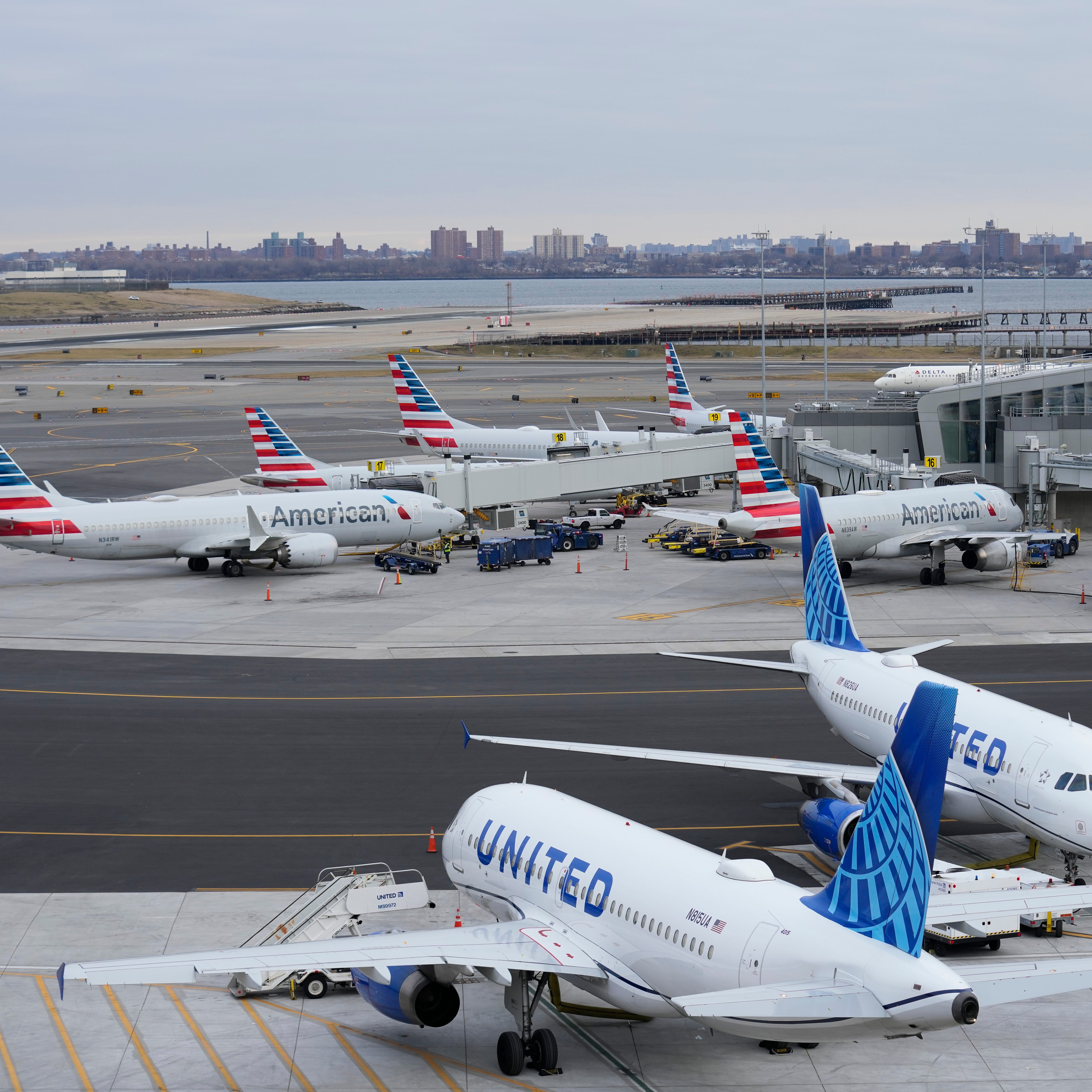 Planes sit on the tarmac at Terminal B at LaGuardia Airport in New York, Wednesday, Jan. 11, 2023.
