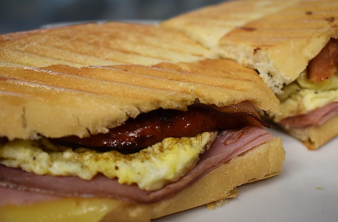 The Europa sandwich, made with ham, cheese, prosciutto, bacon, egg and a chourico patty.
