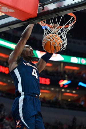 Feb 15, 2023; Louisville, Kentucky, USA; Virginia Cavaliers guard Armaan Franklin (4) dunks against the Louisville Cardinals during the first half at KFC Yum! Center. Mandatory Credit: Jamie Rhodes-USA TODAY Sports