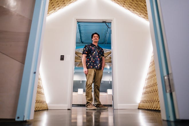 Luke J. Marino stands in the "man trap" separating the lobby from the sales floor in Tuscarawas County's first medical marijuana dispensary, Ratio Cannabis. Only one of the trap's two doors can open at a time. The feature is designed to prevent unauthorized entry to the sales area.